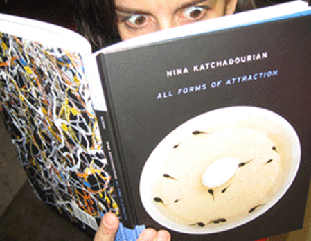 Nina Katchadourian with the monograph from her 10-year survey, which was at the Tang in Saratoga Springs in 2006. (photo from NinaKatchadourian.com)